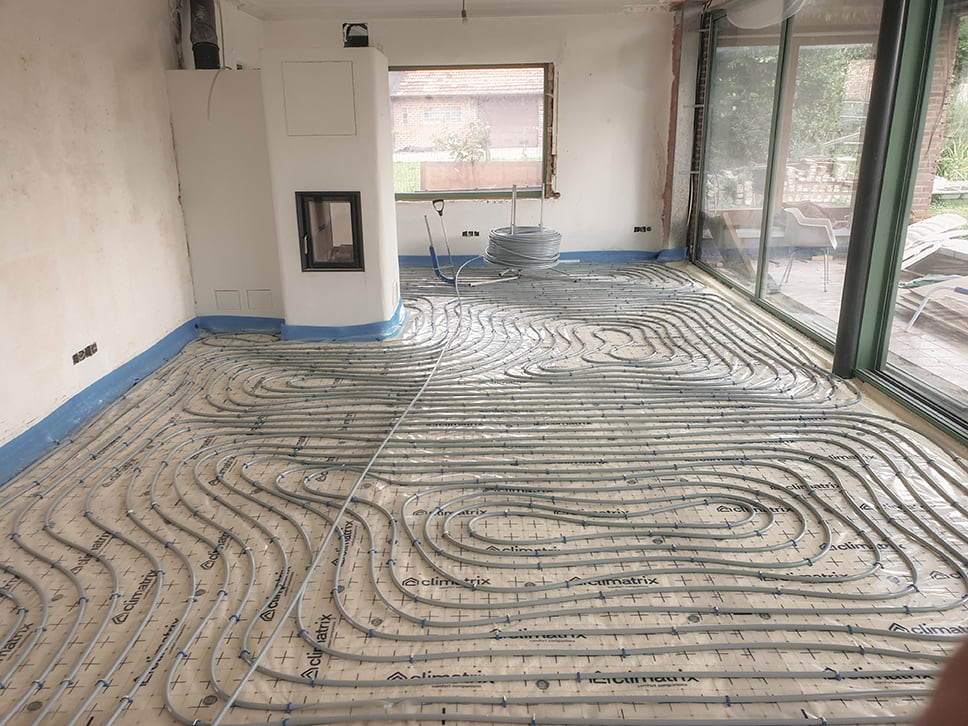 Chauffage au sol en rénovation: ce qu'il faut savoir sur les systèmes basse température